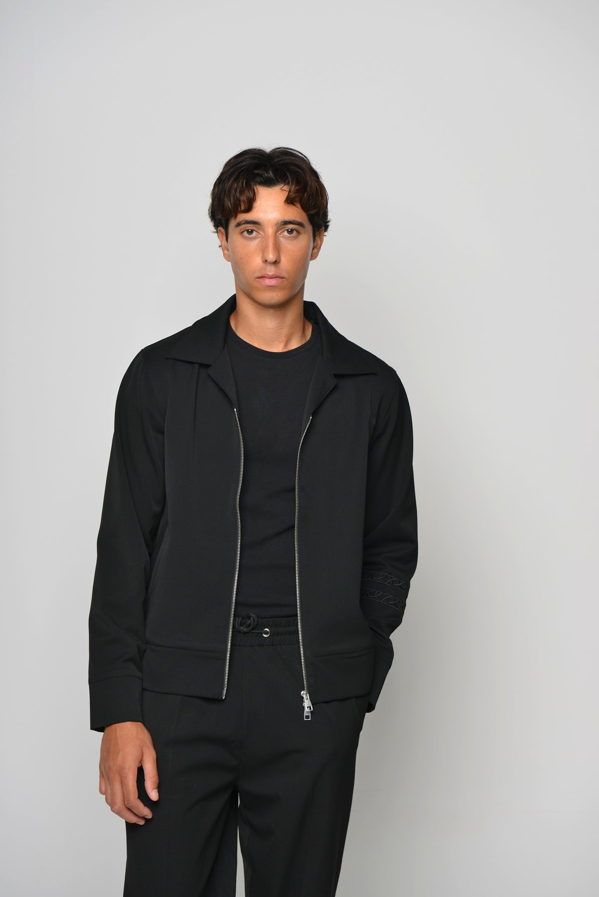 Tailored Collared Jacket in Ink Black, worn open over a black T-shirt, front view